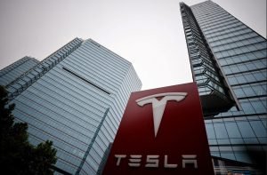  A Tesla logo shown outside a Beijing showroom. The automaker’s estimates of its electric vehicles’ driving range have been among the most aggressive in the industry. It has faced thousands of complaints from customers disappointed by the vehicles’ real-world performance.