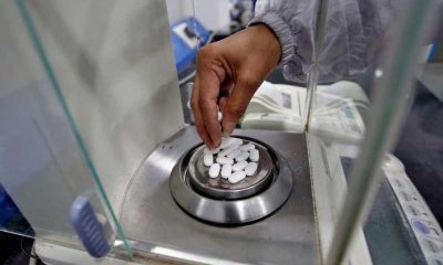 A pharmacist checks weight of Paracetamol, a common pain reliever also sold as acetaminophen, tablets inside a lab of a pharmaceutical company on the outskirts of Ahmedabad