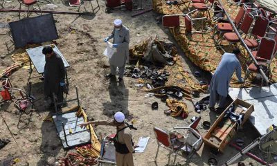Investigators examine the site of Sunday's suicide bomb blast