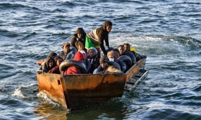 Migrants in a makeshift boat after being found heading for Italy by Tunisian authorities about 50 miles off the coast of Tunisia's city of Sfax