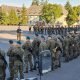 Polish army troops stand guard, as part of the 12th and 17th Mechanized Brigades are starting to move to the east of the country, in Poland