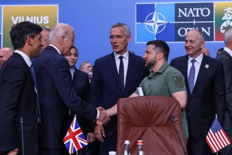 President Joe Biden, Ukraine's President Volodymyr Zelenskiy, NATO Secretary-General Jens Stoltenberg and British Prime Minister Rishi Sunak attend a meeting of the NATO-Ukraine council