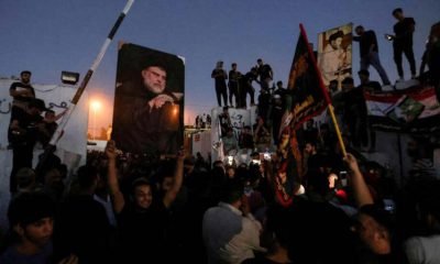 Protesters gather near the Swedish embassy in Baghdad hours after the embassy was stormed and set on fire ahead of an expected Koran burning in Stockholm, in Baghdad