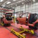Workers at the vehicle dismantler company Charles Trent Ltd take apart a wrecked vehicle for materials and parts to reuse or recycle