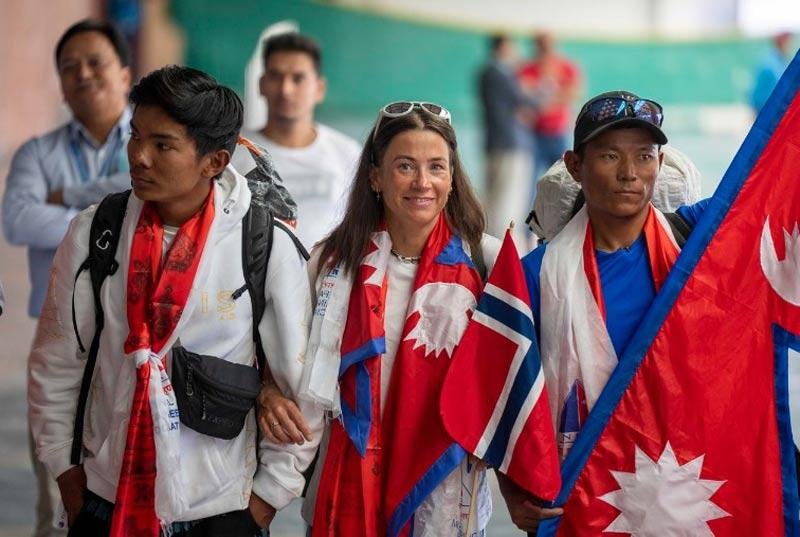 Harila, center and her Nepali Sherpa guide Tenjen Sherpa, right, who last month set a new record by scaling the world's 14 highest peaks in 92 days.