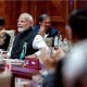 Narendra Modi claps the table as he announces the consensus on the G20 Leaders Summit Declaration while attending "Session II: One Family" at the G20 summit in New Delhi, India, September 9, 2023