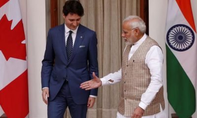 Indian Prime Minister Narendra Modi (R) extends his hand for a handshake with his Canadian counterpart Justin Trudeau during a photo opportunity ahead of their meeting at Hyderabad House in New Delhi, India, February 23, 2018.