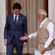 Indian Prime Minister Narendra Modi (R) extends his hand for a handshake with his Canadian counterpart Justin Trudeau during a photo opportunity ahead of their meeting at Hyderabad House in New Delhi, India, February 23, 2018.