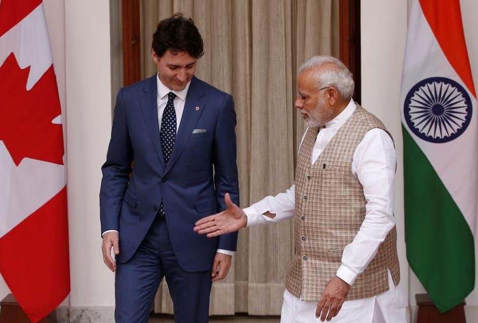 Indian Prime Minister Narendra Modi (R) extends his hand for a handshake with his Canadian counterpart Justin Trudeau during a photo opportunity ahead of their meeting at Hyderabad House in New Delhi, India, February 23, 2018.