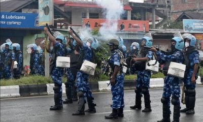 Riot police officers fire tear smoke shells to disperse demonstrators protesting against the arrest of five people, who police said were carrying weapons while wearing camouflage uniform, in Imphal, Manipur, India, September 18, 2023
