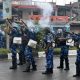 Riot police officers fire tear smoke shells to disperse demonstrators protesting against the arrest of five people, who police said were carrying weapons while wearing camouflage uniform, in Imphal, Manipur, India, September 18, 2023