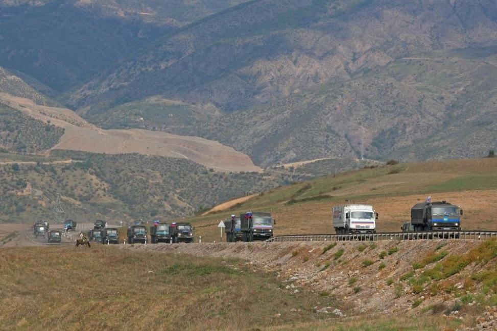 Russian peacekeepers leaving Azerbaijan's Nagorno-Karabakh region for Armenia pass an Armenian checkpoint on a road near the village of Kornidzor, Armenia September 22, 2023