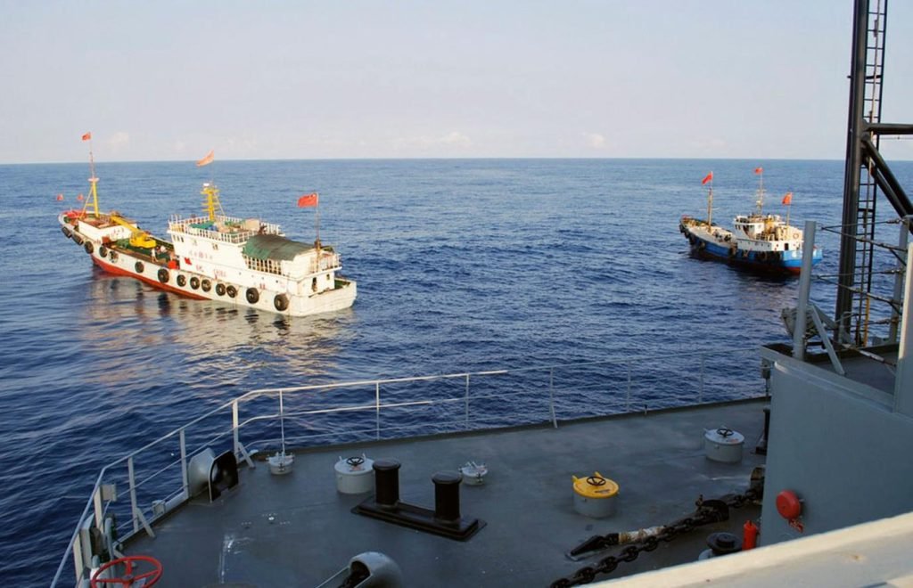 Washington is betting that unmanned surveillance vessels can reduce the likelihood of potentially explosive confrontations such as this run-in with China on March 8, 2009. A U.S. surveillance ship, the USNS Impeccable, was harassed by five Chinese vessels as it conducted routine operations in international waters in the South China Sea, according to the Pentagon. This photo, shot from the USNS Impeccable, shows two Chinese trawlers blocking its way.