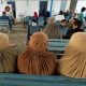 Afghan women who are living in Pakistan wait to get registered during a proof of registration drive at United Nations High Commissioner for Refugees