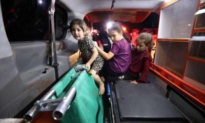 Children sit in the back of an ambulance at Shifa Hospital after hundreds of Palestinians were killed in a blast at Al-Ahli hospital in Gaza that Israeli and Palestinian officials blamed on each other in Gaza City, Gaza Strip, October 17, 2023