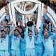 Englands-Eoin-Morgan-and-team-mates-celebrate-winning-the-world-cup-with-the-trophy.jpg