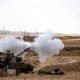 An Israeli tank fires near Israel's border with the Gaza Strip, in southern Israel, October 12, 2023