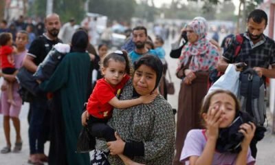 People flee their homes in Khan Younis, amid Israeli strikes in the southern Gaza Strip