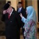 Sultan Ibrahim Iskandar of Johor wipes his tears next to his sister Malaysia's Queen Tunku Azizah Aminah Maimunah Iskandariah after the election for the next Malaysian king