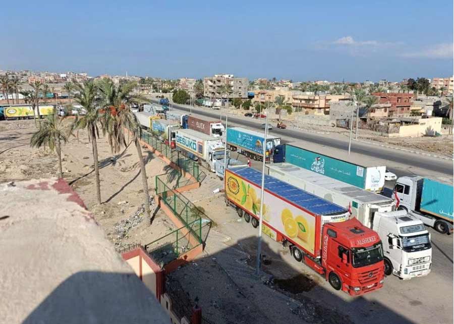 A view of trucks carrying humanitarian aid for Palestinians, as they wait for the re-opening of the Rafah border crossing to enter Gaza, amid the ongoing conflict between Israel and the Palestinian Islamist group Hamas, in the city of Al-Arish, Sinai peninsula, Egypt