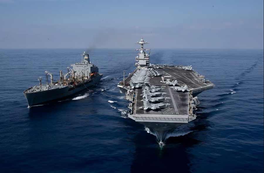 world’s largest aircraft carrier USS Gerald R. Ford steams alongside USNS Laramie (T-AO-203) during a fueling-at-sea in the eastern Mediterranean Sea, as a scheduled deployment in the U.S Naval Forces Europe area of operations, deployed by U.S. Sixth Fleet to defend U.S, allied, and partners