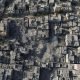 Palestinians gather at the site of Israeli strikes on houses in Bureij in the central Gaza Strip