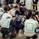 Drill participants cover their heads in a designated area inside Nerima train station in Tokyo, Japan November 6, 2023