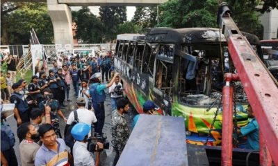 public bus burns after it was set on fire by unidentified people during a countrywide blockade called by the Bangladesh Nationalist Party