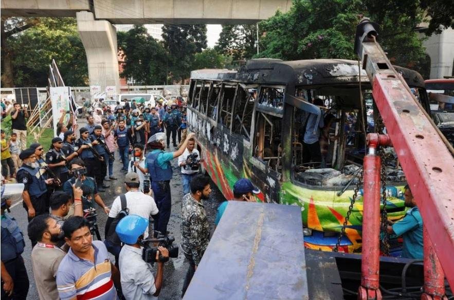 public bus burns after it was set on fire by unidentified people during a countrywide blockade called by the Bangladesh Nationalist Party