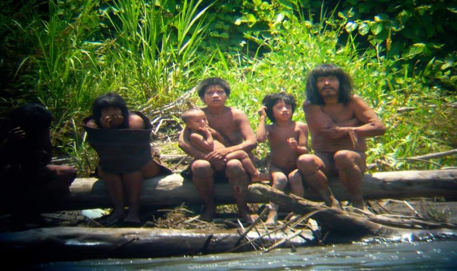 Members of the Mashco-Piro tribe observe a group of travelers from across the Alto Madre de Dios river in the Manu National Park in the Amazon basin of southeastern Peru, as photographed through a bird scope, October 21, 2011. Peru prohibits contact with the Mashco Piro and another dozen "uncontacted" tribes, mainly because their immune systems carry little resistance to common illnesses.